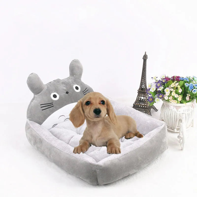 Cartoon-style sofa bed for small dogs or cats, shown in a choice of colours with soft plush interior.