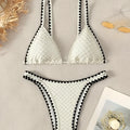 Women's white and blue split bikini swimsuit set with polyester fabric
