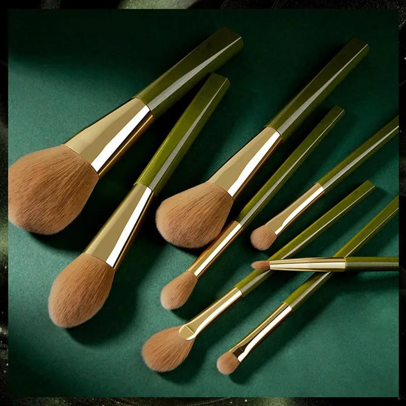 8-piece makeup brush set with man-made fibre bristles, wood handles, 17cm total length, and green shimmering PU bag