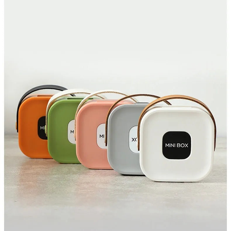 Medium solid-colour polypropylene storage box with lid for cables and headphones.