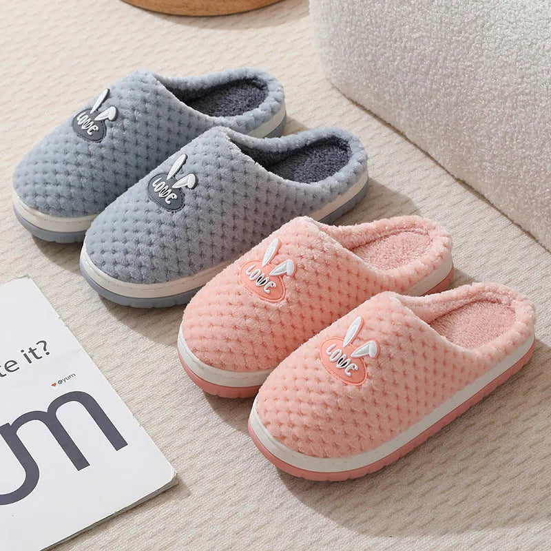 Rabbit plaid design women's plush slippers with anti-slip rubber soles in apricot colour.