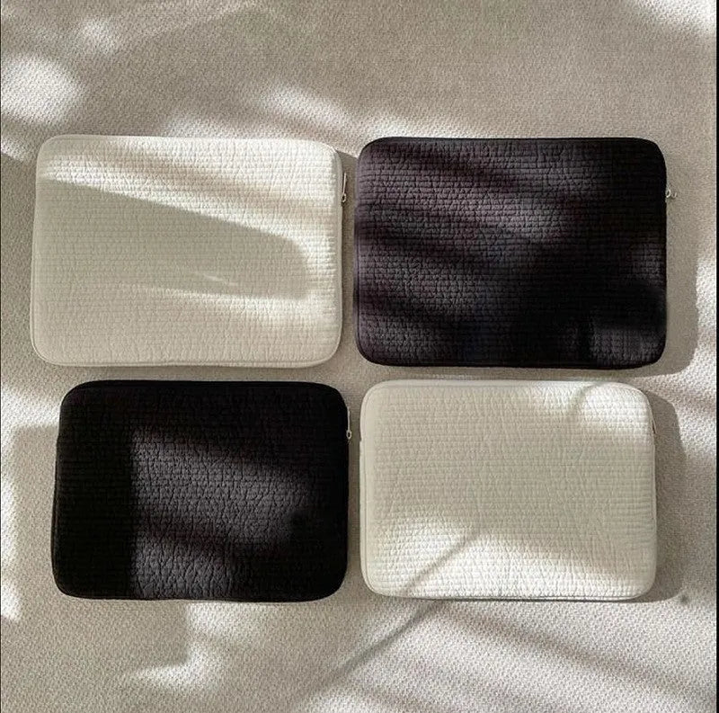 Black and white hand-held anti-seismic laptop bag for tablet protection