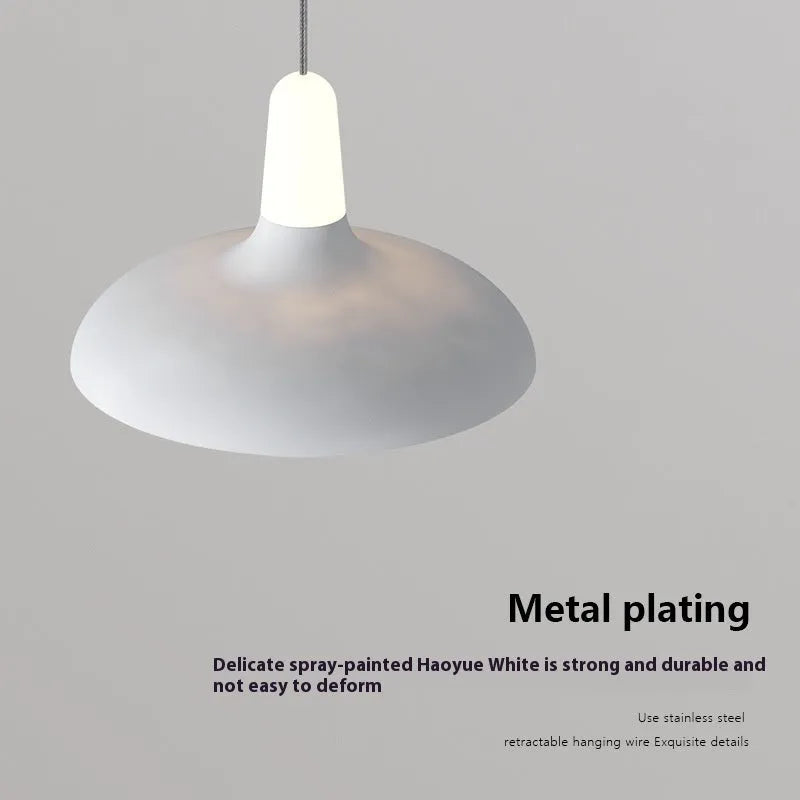 Adjustable Nordic style bedside pendant light in obsidian black finish with three colour temperature settings