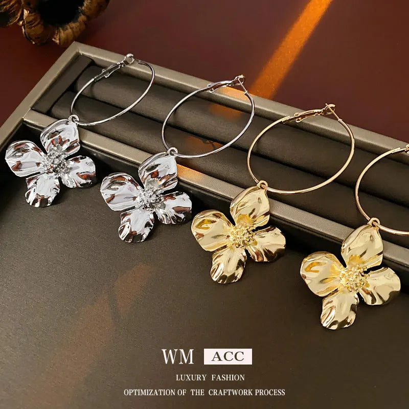 Silver Needle Metal Flower Earrings showing geometric floral pendant on long needle post in gold or silver.