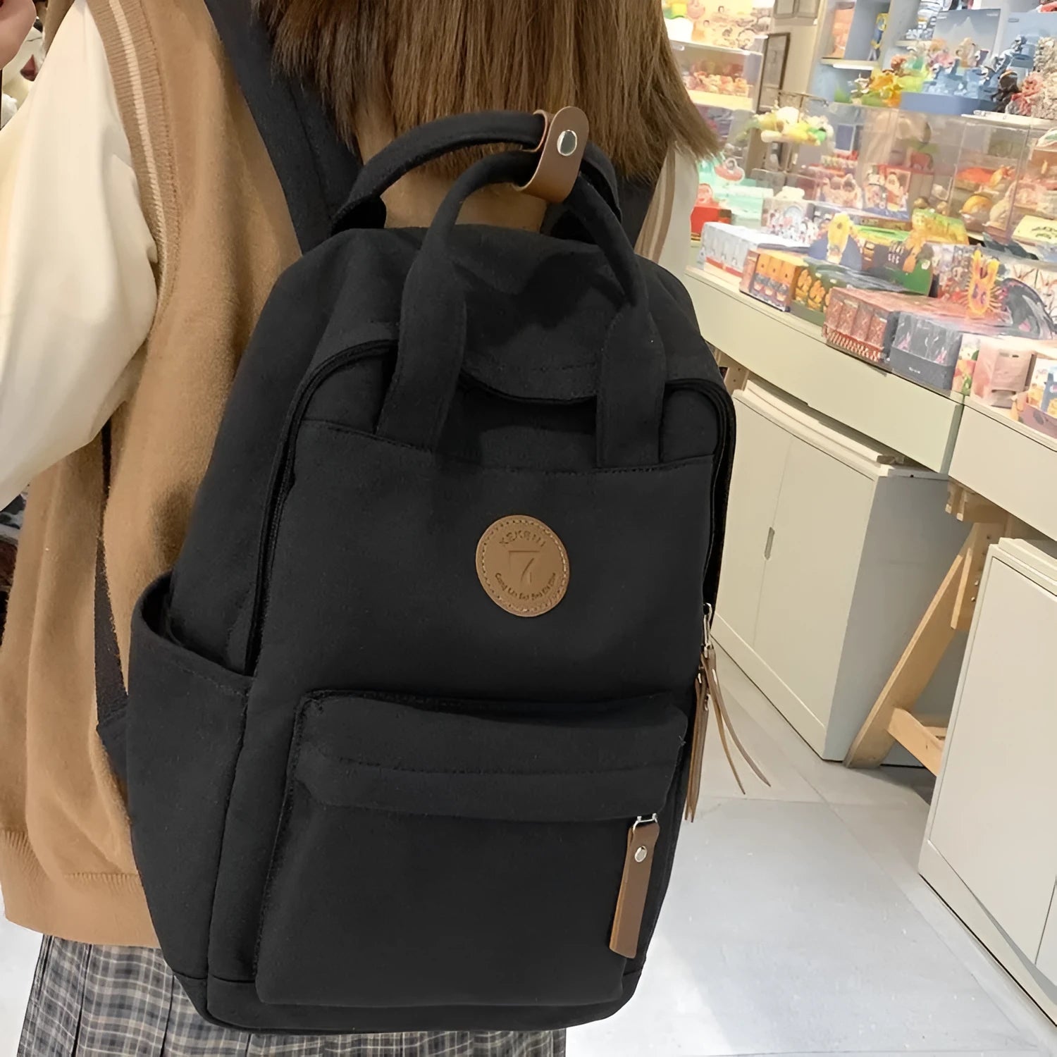 Black Oxford cloth leisure travel backpack with curved shoulder straps