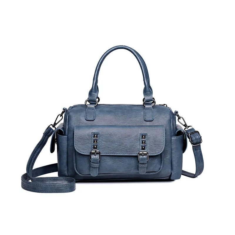 Large vintage-style messenger bag in a horizontal square shape, showing stitching detail, displayed in multiple colour options.
