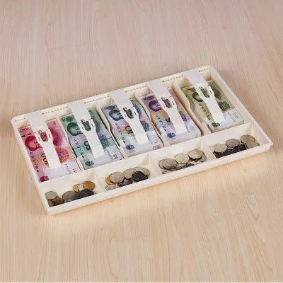 Black and white ABS plastic cash register box with five drawers for banknotes and coins.