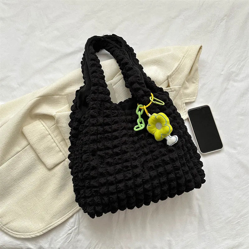 Soft pleated polyester women's crossbody bag in square shape with detachable pendant.