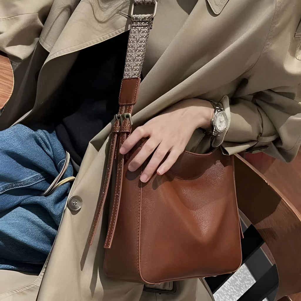 Genuine leather women's messenger bag with multiple internal compartments in black, sugar brown, golden brown, or dark green.