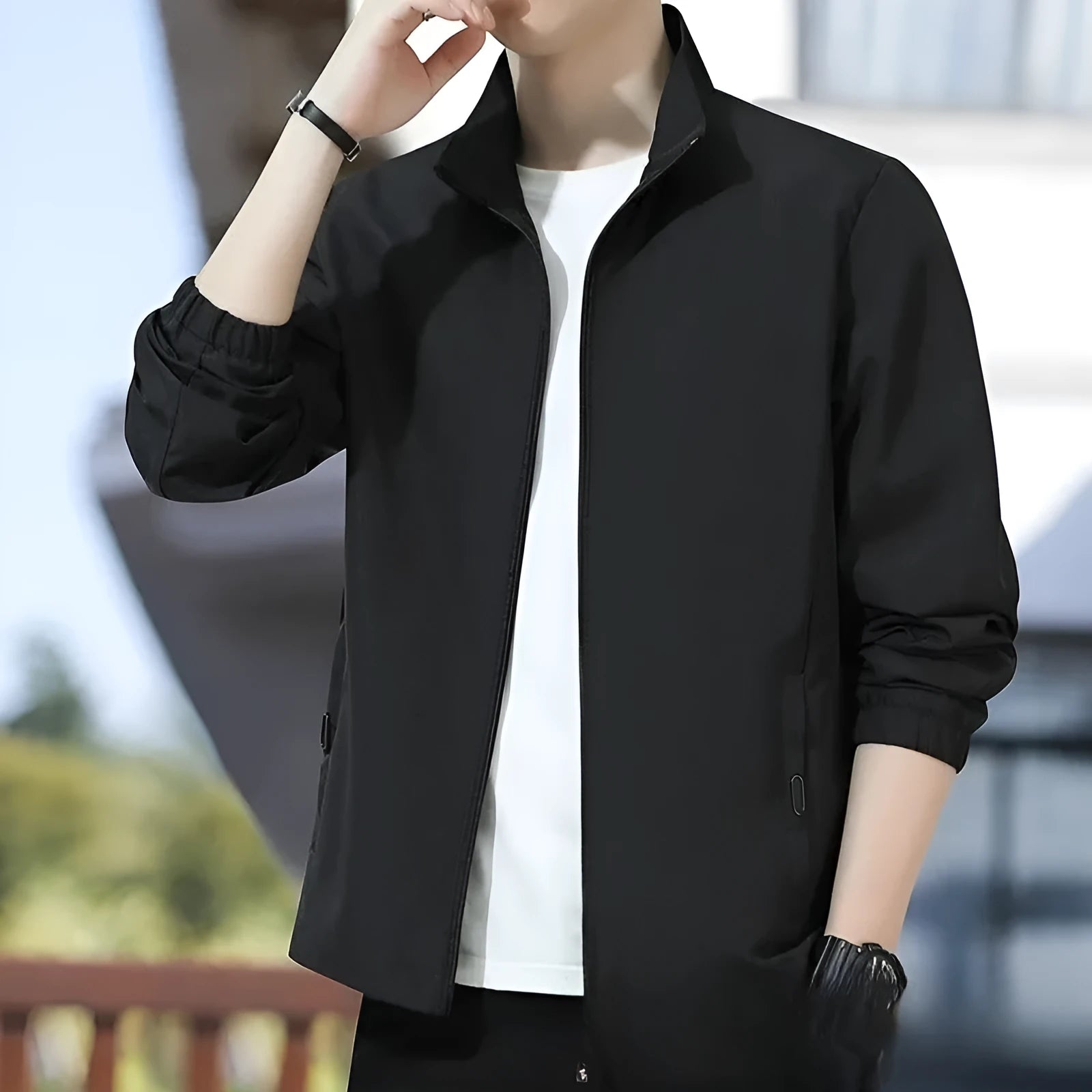 Man wearing a loose-fit grey lapel jacket, a Korean-style autumn casual outerwear piece with zipper pockets.