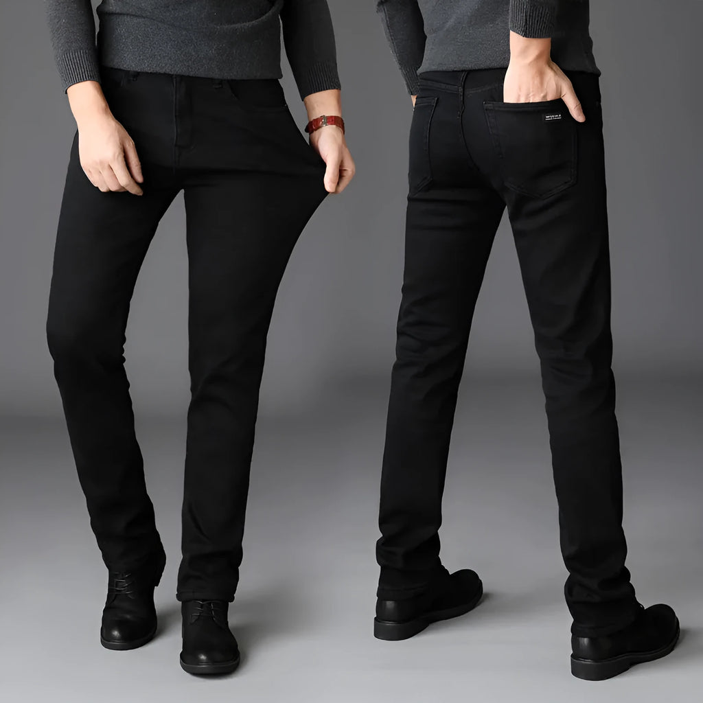 Men's slim straight leg jeans in black cotton denim with mid waist and zip fly, sizes 28-40.