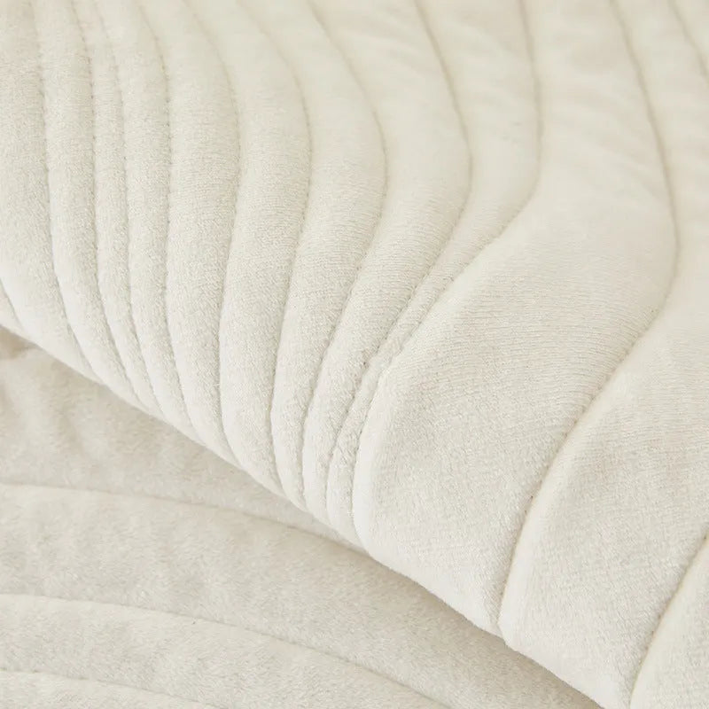 Thickened non-slip flannel sofa cover with geometric pattern in beige on a modern sofa