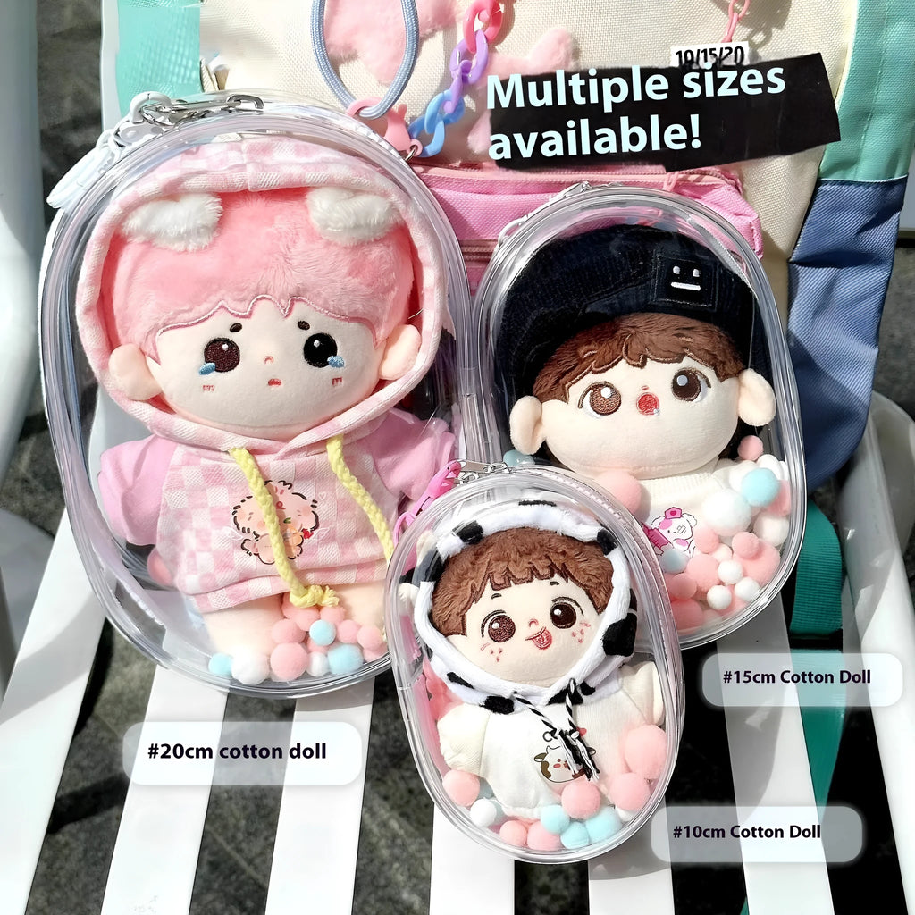 Transparent PVC cube storage bag with cartoon keychain and colourful ball in avocado green.