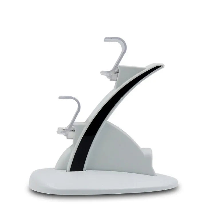 White dual PS4 controller charger with light-up docks showing blue glow and flashing modes