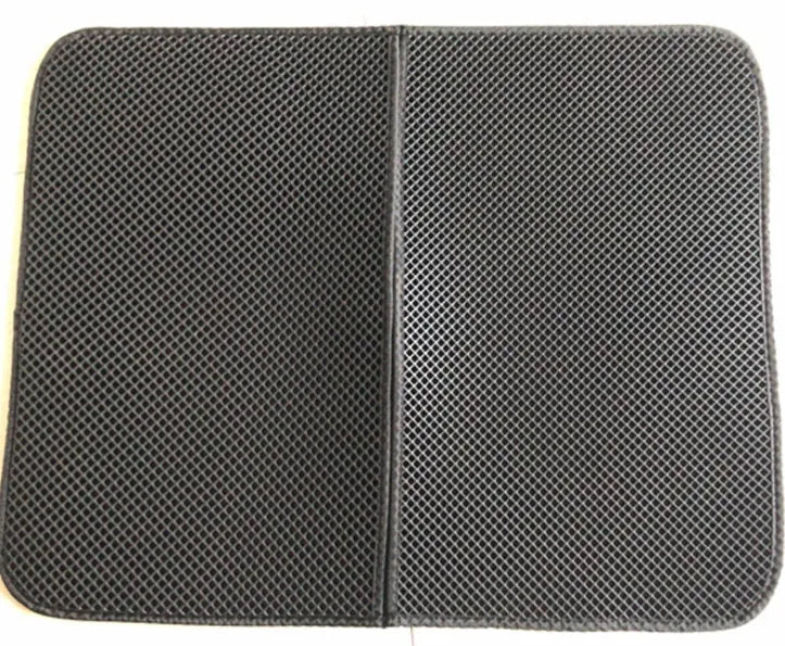 Waterproof EVA double-layer cat litter mat in black honeycomb design, size L foldable, placed under a litter box