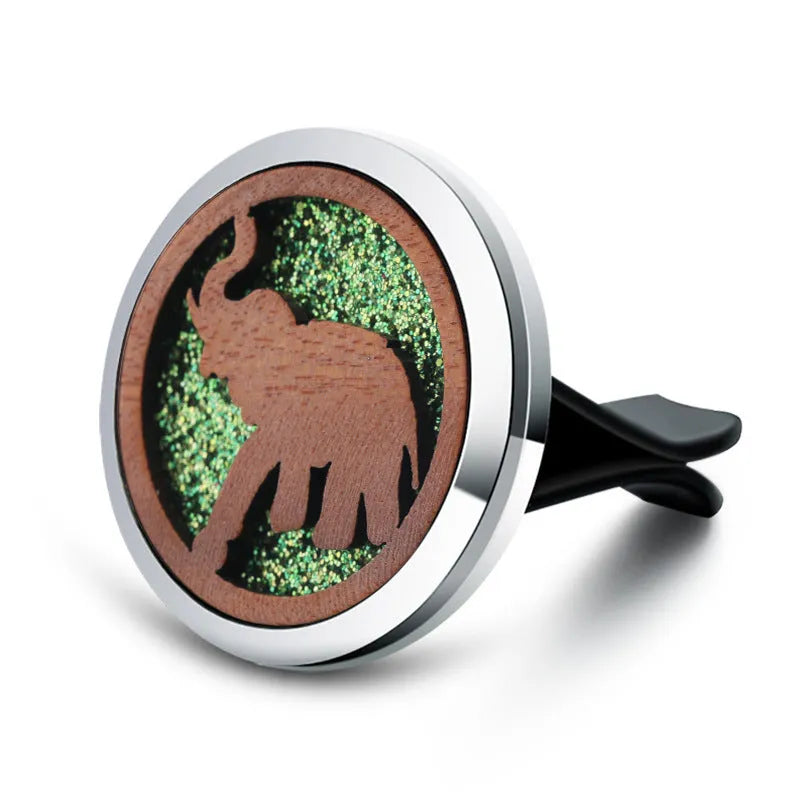 Round car vent aromatherapy clip in alloy wood construction showing hollow centre for incense
