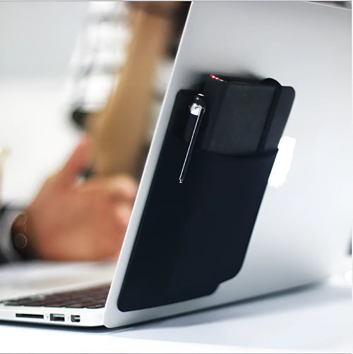 Black adhesive laptop back storage bag attached to a laptop, 15x12 cm, with pen loop and small items inside