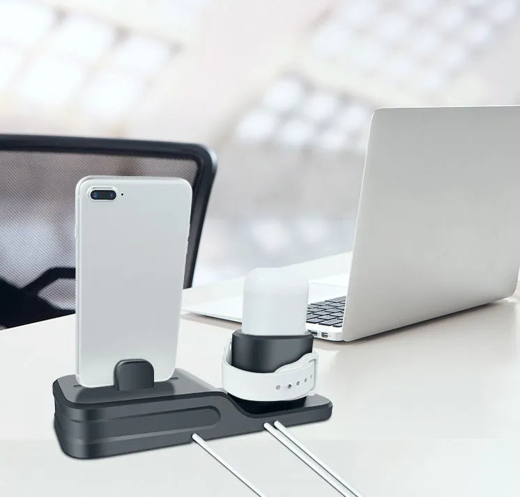 Black silicone 3-in-1 wireless charging station for Apple Watch, AirPods and iPhone on a desk
