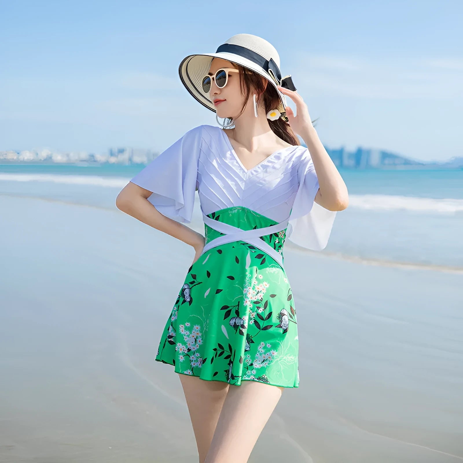 Women's one-piece swimsuit in chemical fibre blend with printed pattern in green or blue colour
