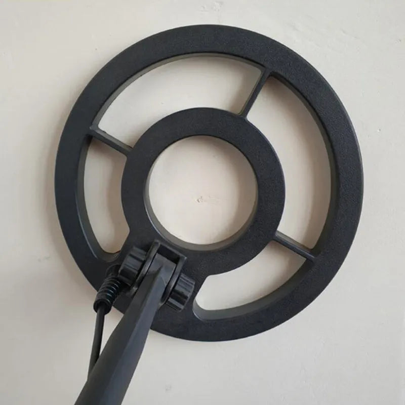 GC1028 black and yellow professional metal detector with LCD screen and adjustable pole on grass.