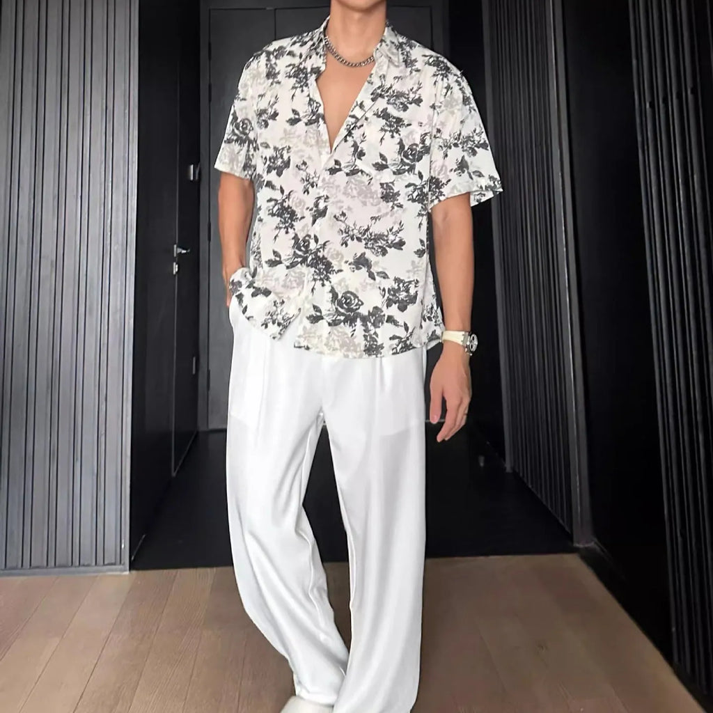 Women's loose-fit floral print short sleeve shirt in white, shown with a cardigan-style button front.