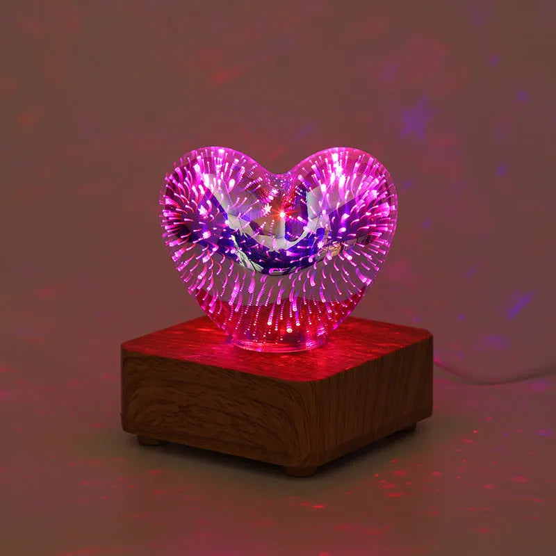 3D love glass small night lamp with silver electroplated finish and solid wood base on a bedside table
