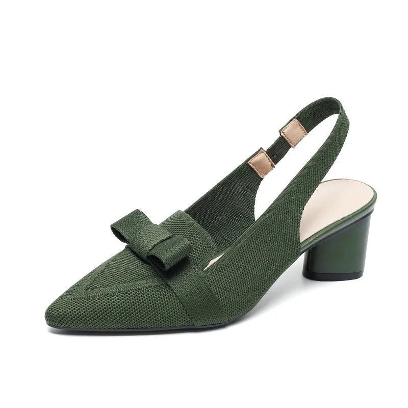 Women's black closed toe high heel sandals with a bow detail and an ankle strap on a rubber sole.