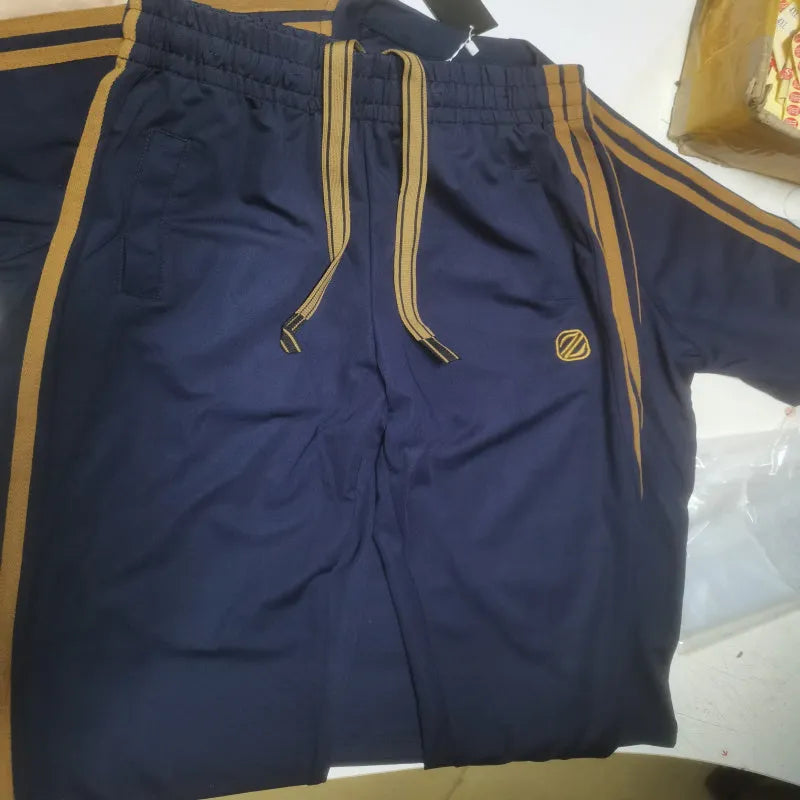 Men's blue ice silk style short sleeve suit top and trousers laid flat.