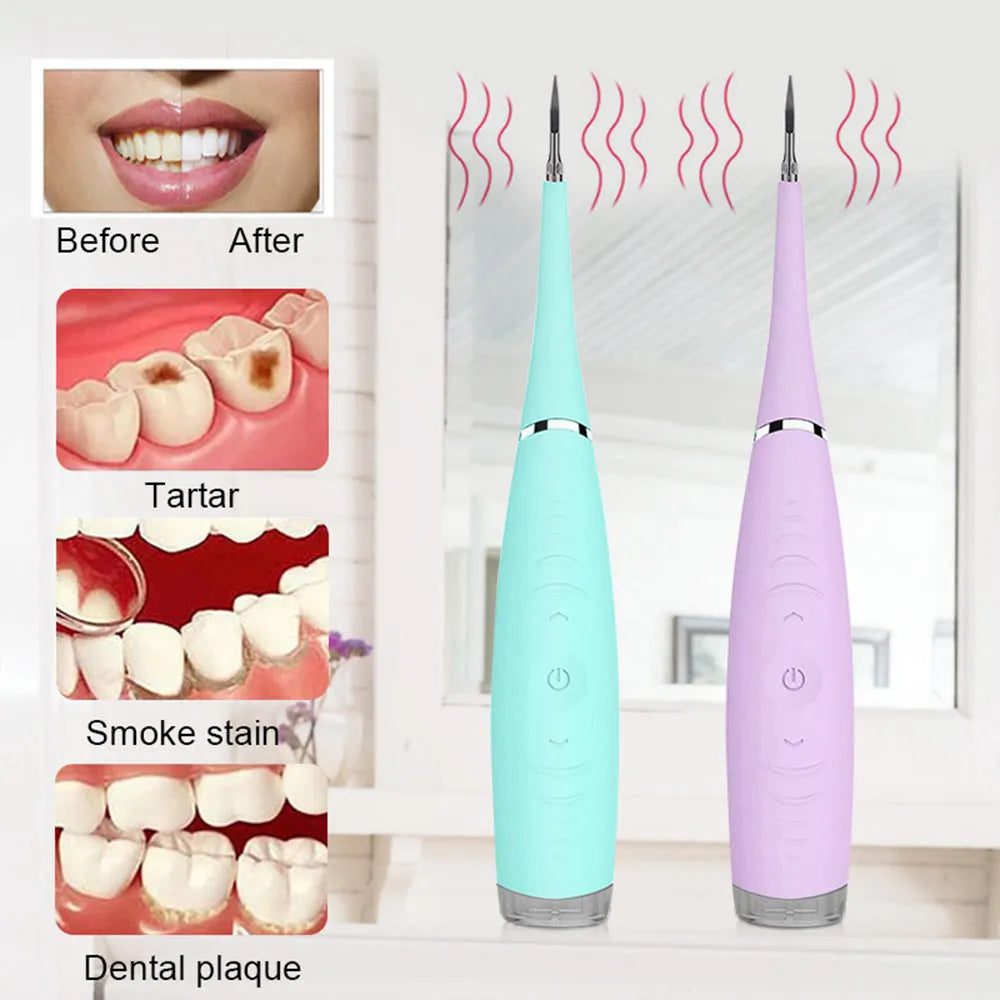 Pink and blue waterproof electric dental scaler tool on a bathroom counter with charging cable.