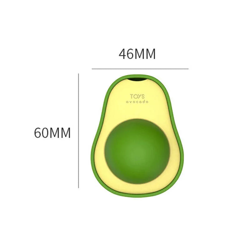 Avocado-shaped catnip wall toy attached to a smooth window with a silvervine ball for cat teeth cleaning
