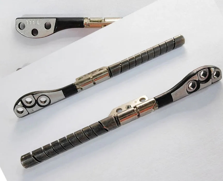 Pair of silver laptop screen hinge shafts for Apple MacBook Pro 15-inch A1286 model.