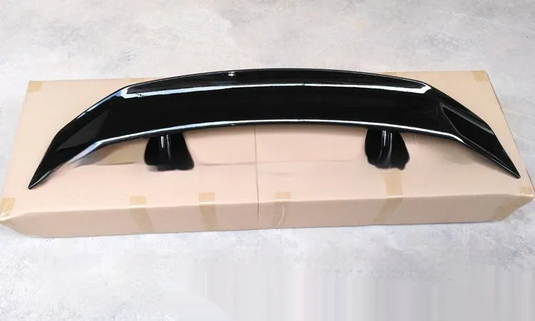 Universal punch-free ABS plastic car spoiler tail wing in black, white, carbon pattern, or blank finish.