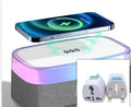 White multifunctional alarm clock with Bluetooth speaker and wireless charging pad on wooden table