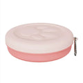 Collapsed and open views of a pink silicone dog bowl with matching sealing lid, next to a dog lead.