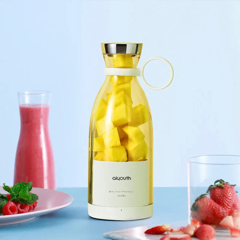 Handheld mini juicer in pink colour with USB charging port and automatic cleaning function