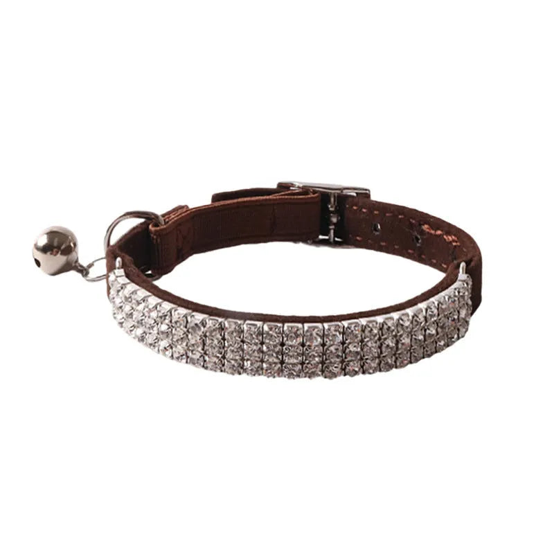 Flocked fabric cat collar with elastic buckle and gang drill pattern in multiple colours.