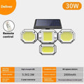 Solar-powered garden lamp with motion sensor mounted on a wall, illuminating an outdoor path.