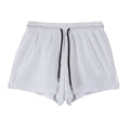 A pair of men's quick-dry nylon shorts in black on a hanger, showing the mid-waist fit and shorts length.