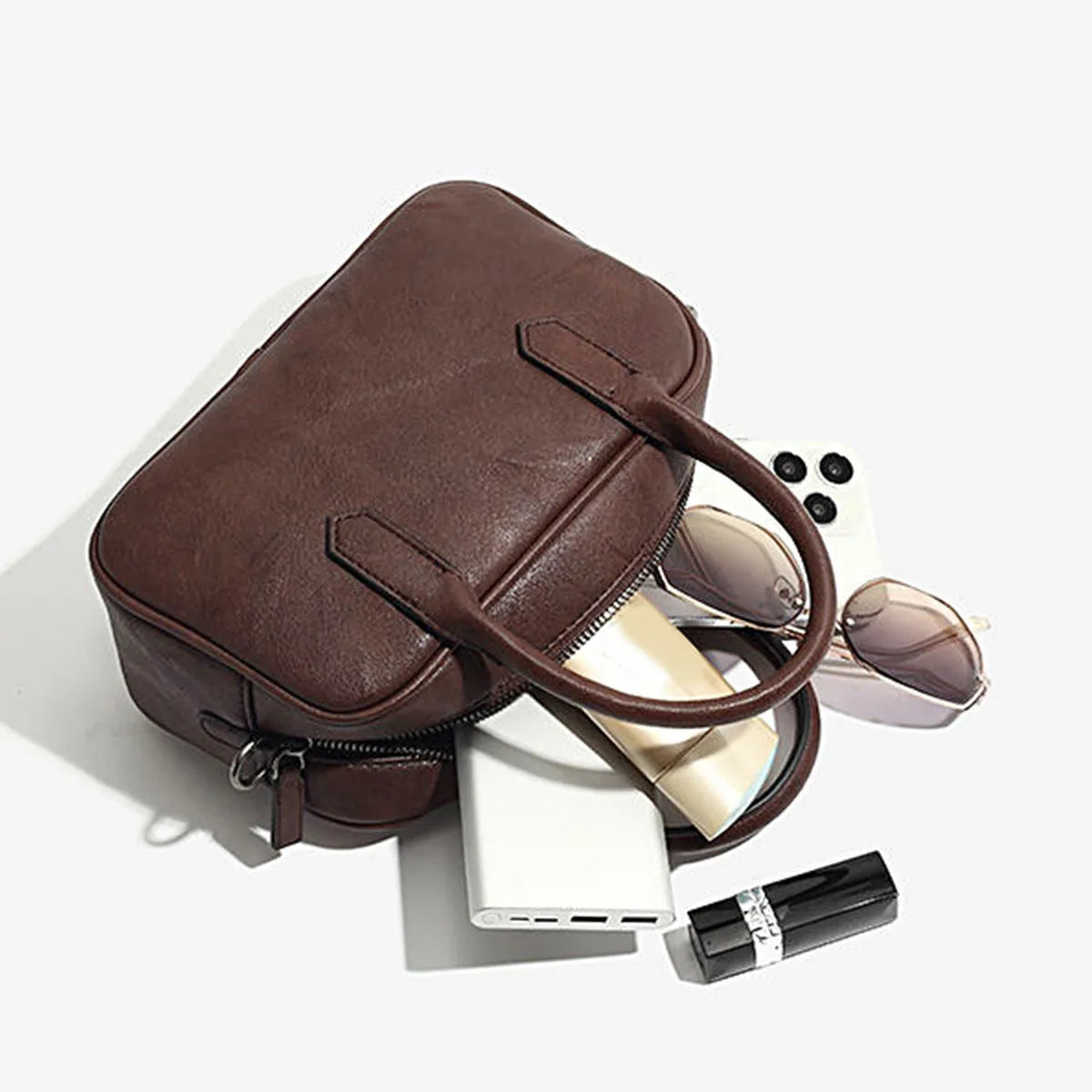 Retro small square PU leather messenger bag in black and coffee brown colours with a single adjustable strap.