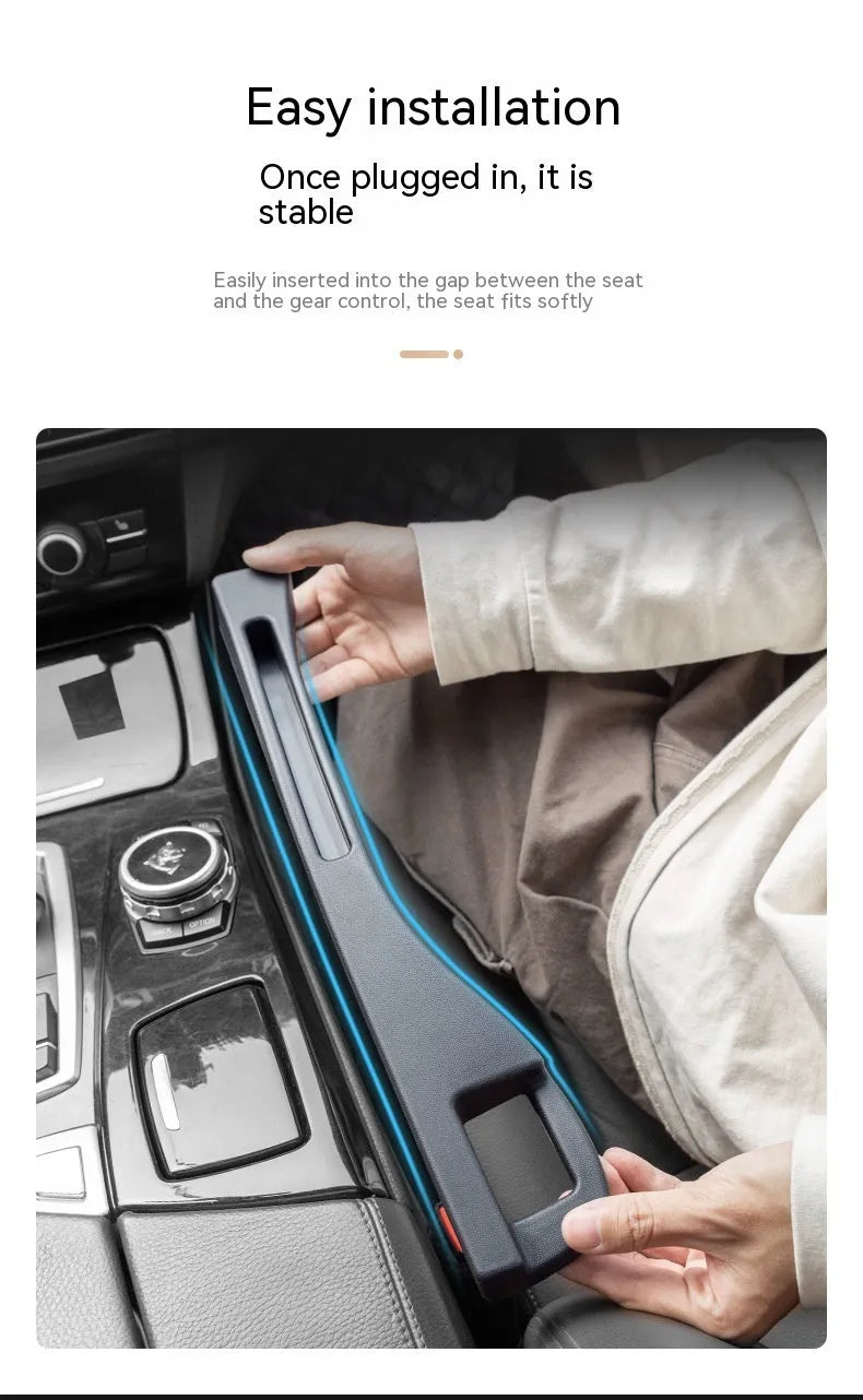 Black plastic car seat gap storage organiser box with handle inserted between vehicle seats