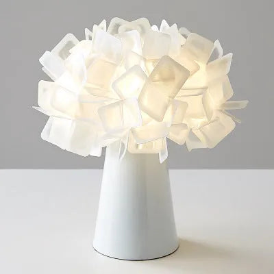 Nordic-style decorative table lamp with metal holder in black, showing warm, white, and neutral light settings.