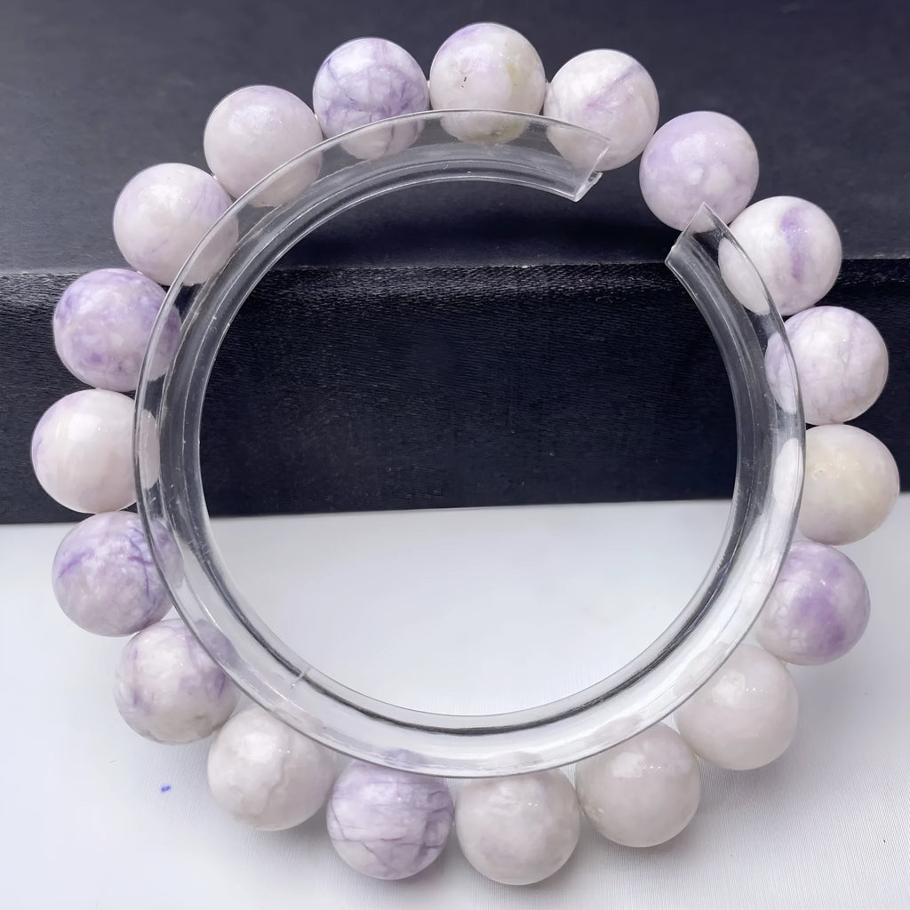 A natural purple turquoise bead bracelet for women, shown in a choice of 6mm, 8mm, or 10mm bead sizes.