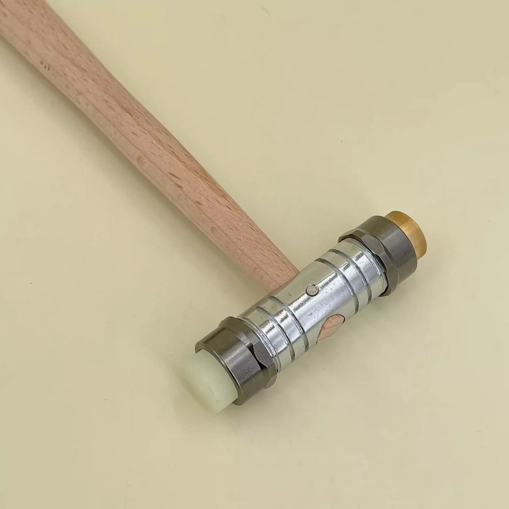 Brass hammer with wooden handle for watch repair and jewellery dismantlement