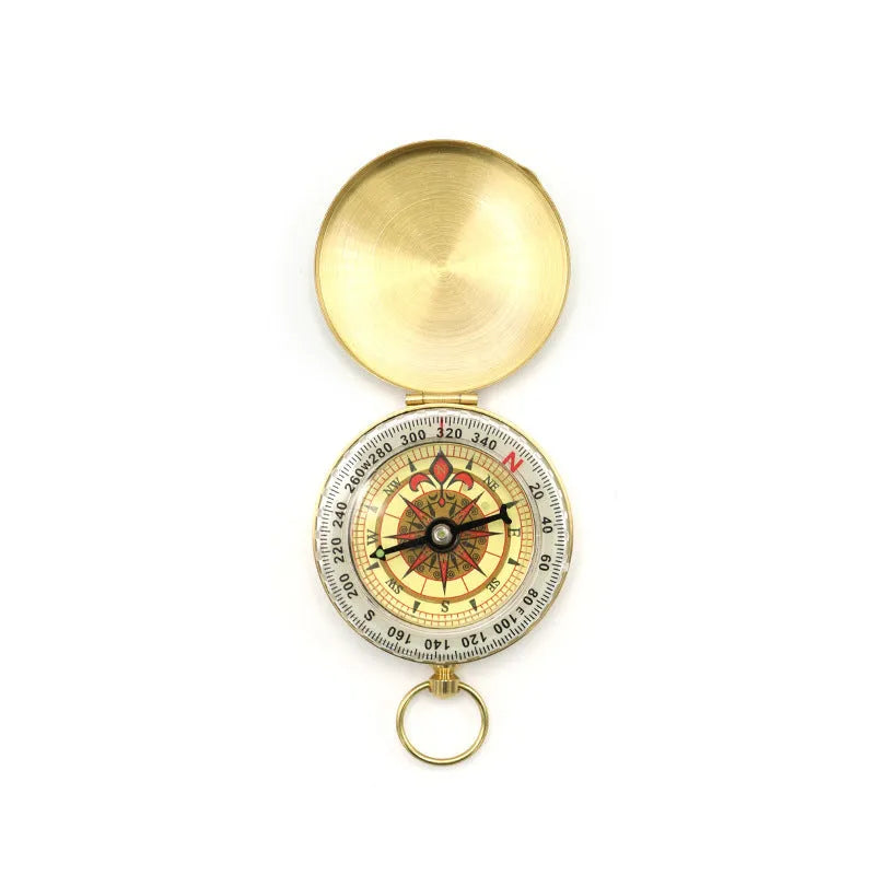 Gold brass flip compass with luminous dial and lid closed, 50mm diameter for outdoor navigation