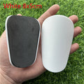 Extra small mini football shin guards in black and white plastic for youth players