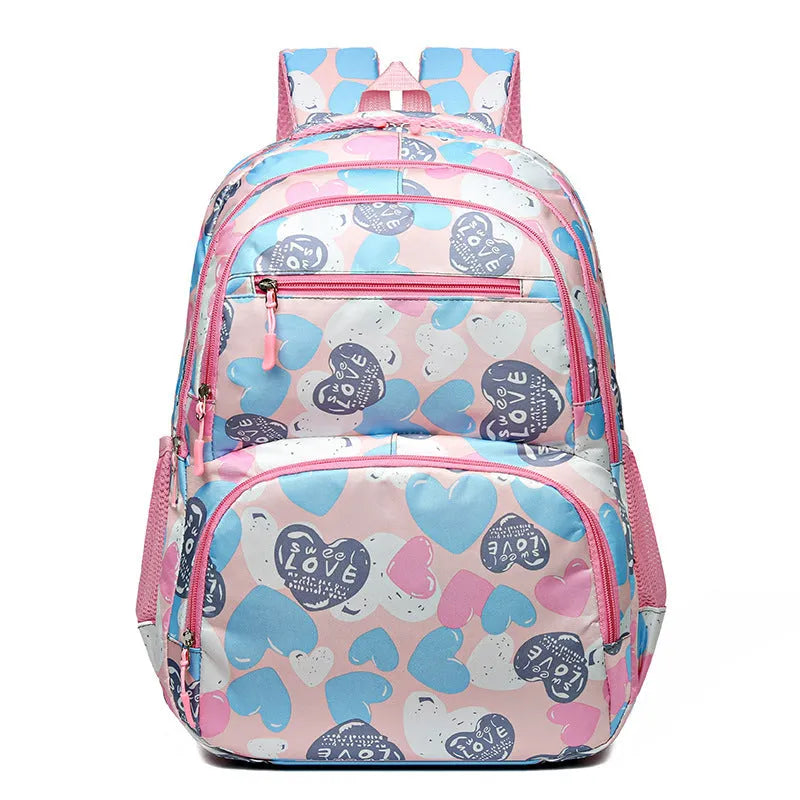 Blue student backpack with air pillow shoulder straps and large main compartment.