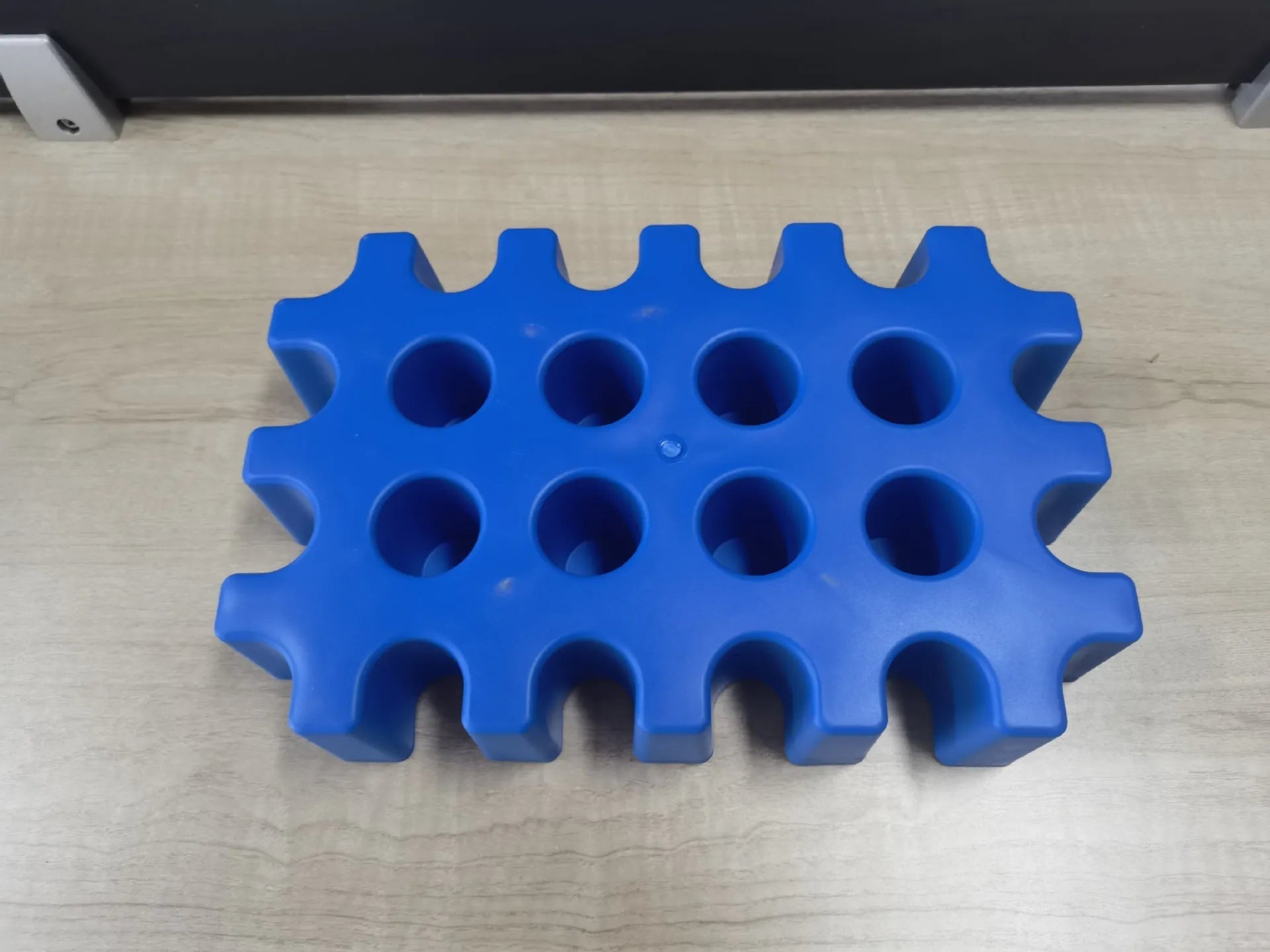 Blue plastic reusable ice block maker tray for outdoor coolers and camping.