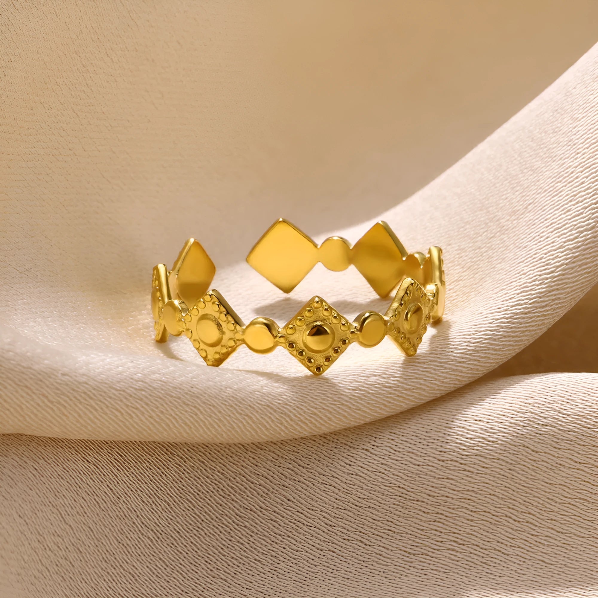Geometric gold diamond titanium steel women's ring on white background