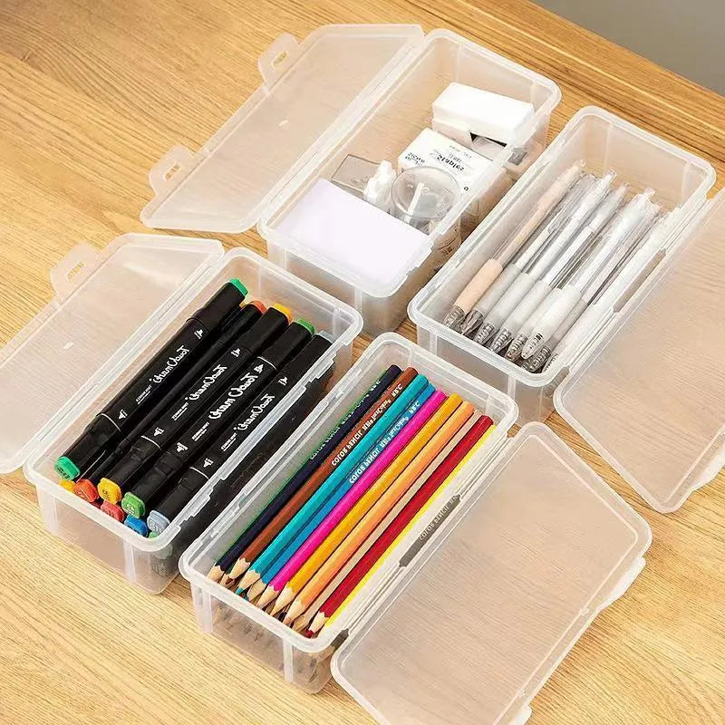 Clear transparent plastic storage box filled with coloured pencils and crayons with lid open.