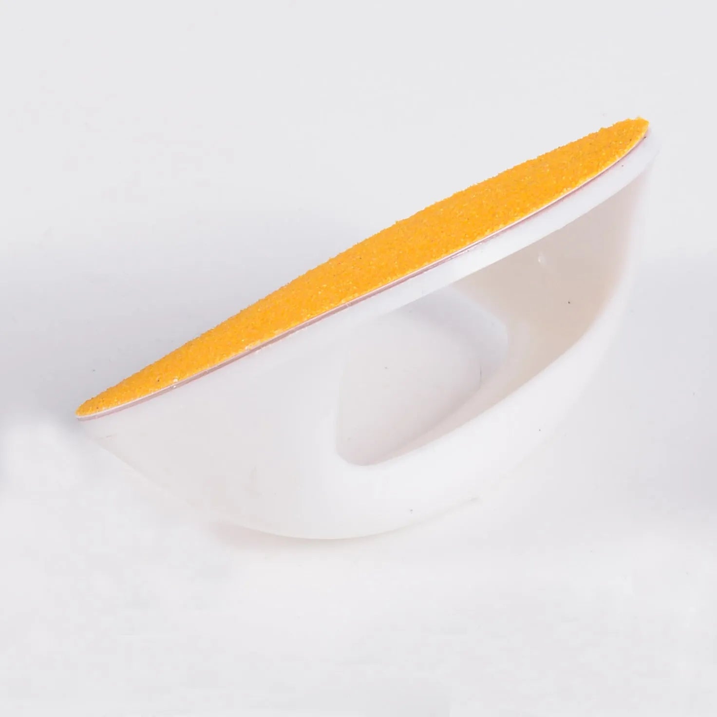 Square dog nail scratch board with ergonomic handle in one of four colours, showing replaceable sandpaper pad.